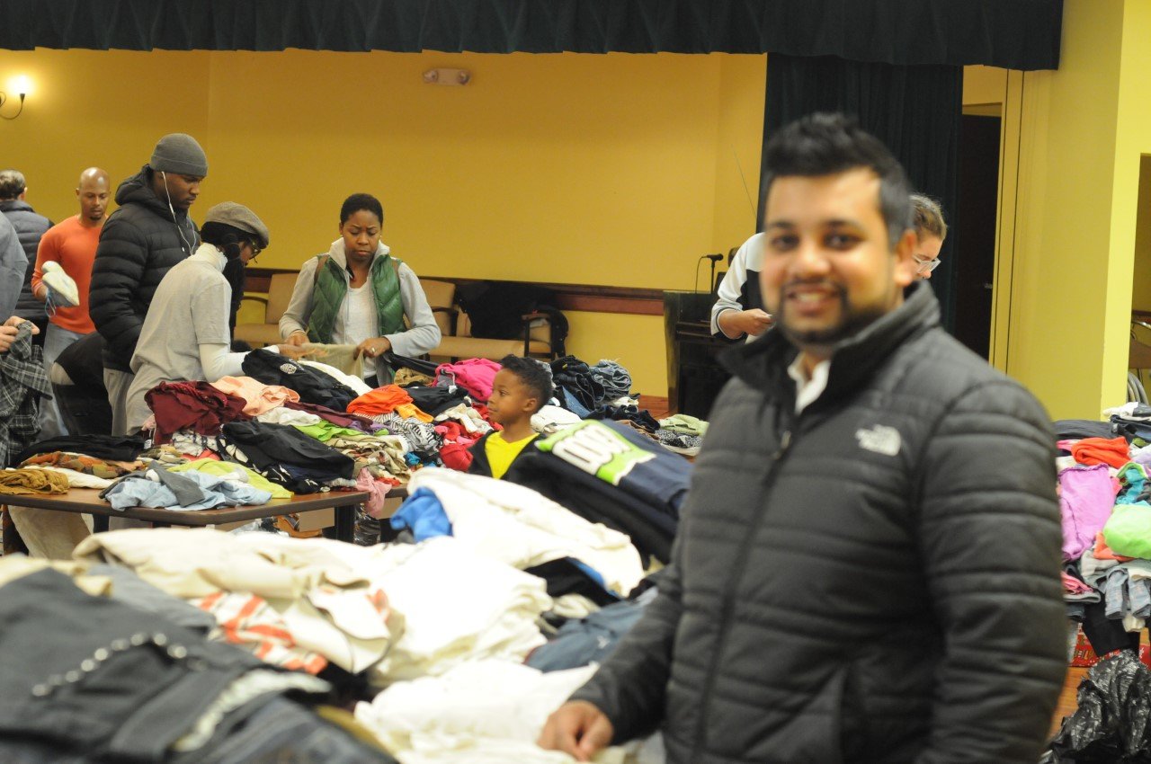 Community members participating in a clothing outreach event.