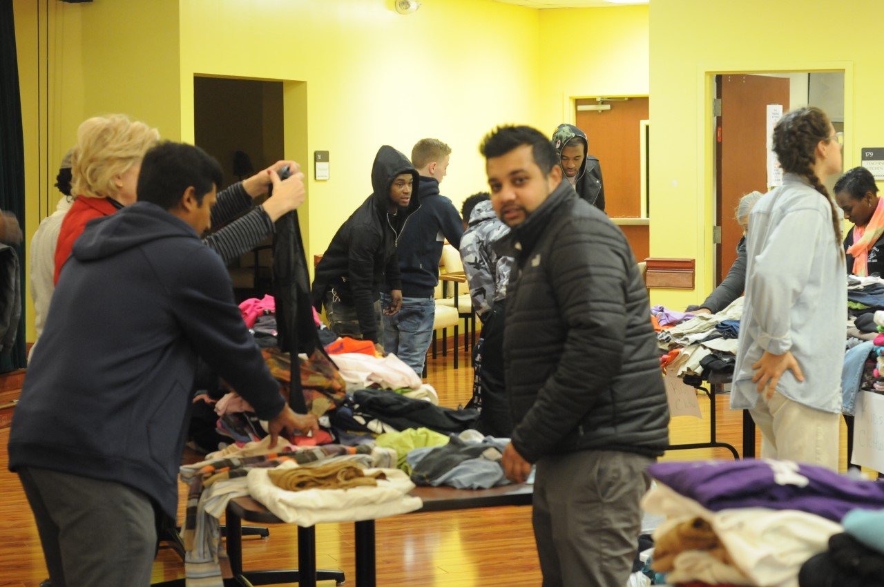 People sorting clothing donations